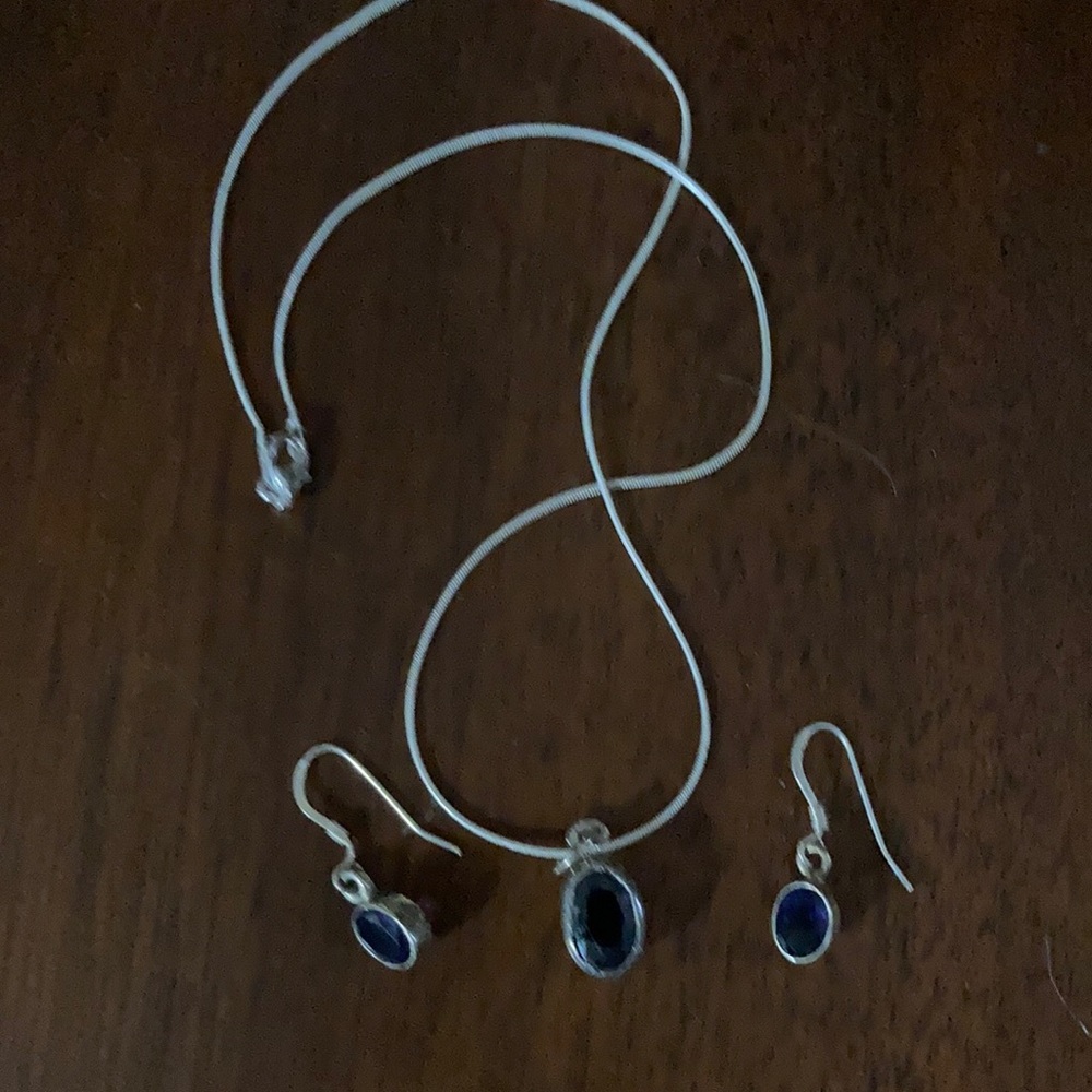 Deep purple stones in sterling silver. Pendant necklace and earrings.